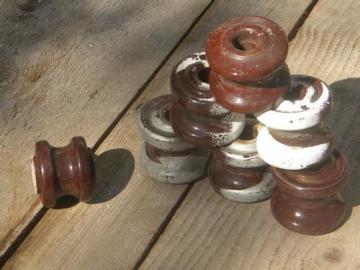 catalog photo of large old brown ceramic round insulators for architectural or farm