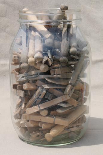 photo of large old gallon jar full of vintage clothespins, primitive wood clothespins lot #1