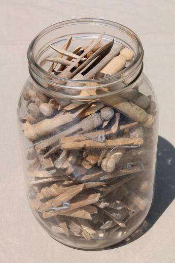 photo of large old gallon jar full of vintage clothespins, primitive wood clothespins lot #1