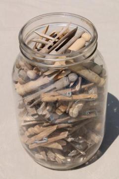 catalog photo of large old gallon jar full of vintage clothespins, primitive wood clothespins lot