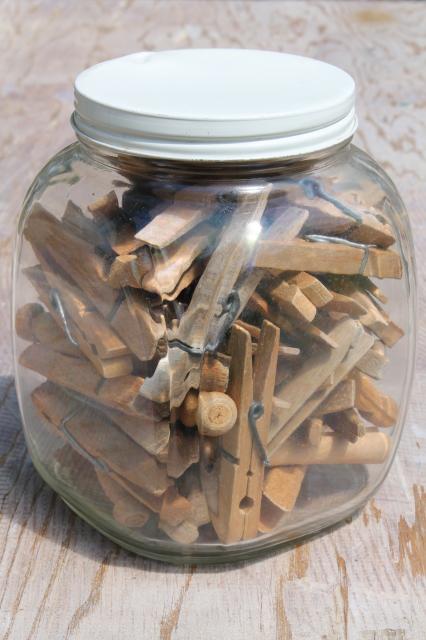 photo of large old glass jar full of vintage clothespins, primitive wood clothespins lot #1