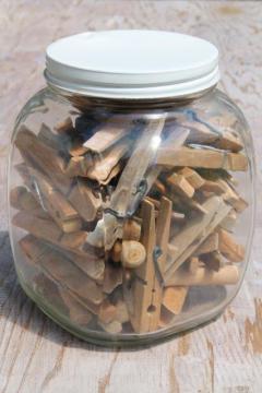 catalog photo of large old glass jar full of vintage clothespins, primitive wood clothespins lot