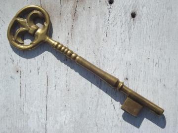 catalog photo of large solid brass key, steampunk style paperweight for work table or desk