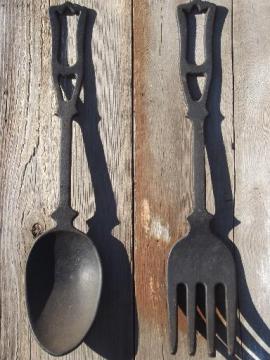 catalog photo of large spoon & fork, vintage kitchen wall art, black cast iron utensils