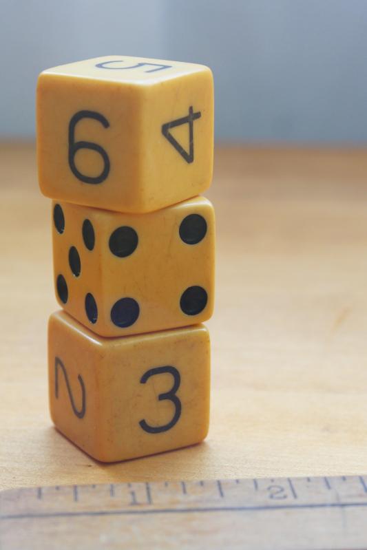 photo of large vintage bakelite dice, numbered dice & classic dotted die, butterscotch color #4