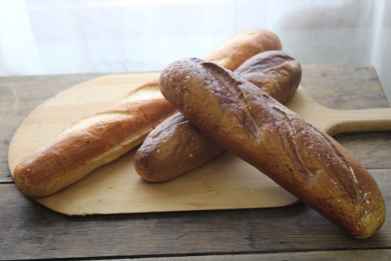 photo of life size baguettes faux bread loaves photo stylist prop, french country farmhouse style decor fake food #1