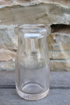catalog photo of little old glass milk bottle, 1/4 pint size vintage bottle w/ faint pink purple color