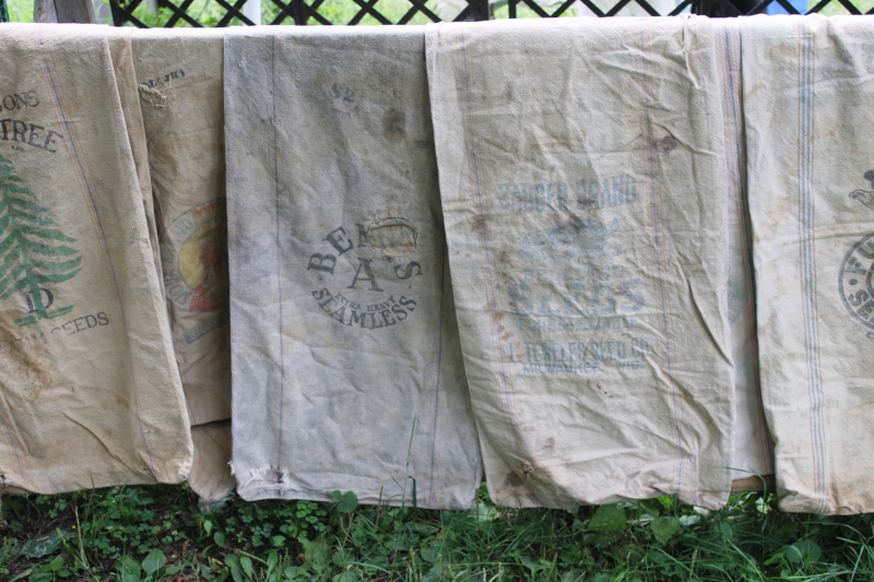 photo of lot of 12 shabby old heavy cotton grain bags, primitive fabric seed & feed sacks w/ vintage graphics #1