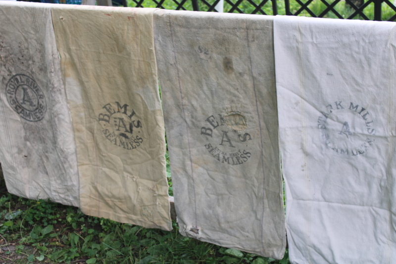 photo of lot of 12 shabby old heavy cotton grain bags, primitive fabric seed & feed sacks w/ vintage graphics  #13