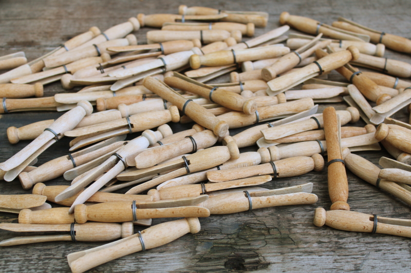 photo of lot of 50 old hardwood clothespins, vintage wire wrapped peg type clothespins  #1