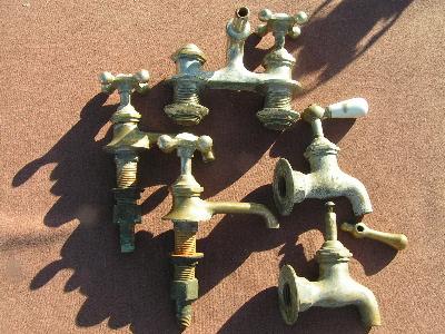 photo of lot of antique brass faucet parts #1