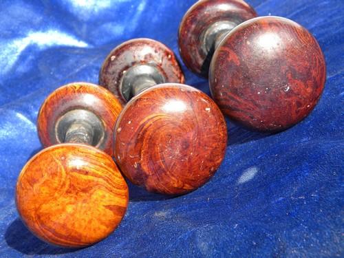 photo of lot of antique brown swirl door knobs, vintage architectural hardware #3