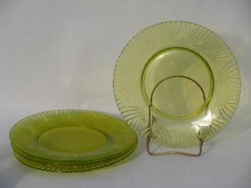 catalog photo of lot of four vintage yellow-green vaseline pressed pattern glass plates