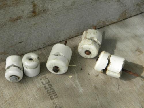 photo of lot of large assorted antique white porcelain nail insulators #1