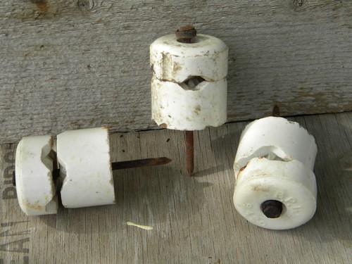 photo of lot of large assorted antique white porcelain nail insulators #2