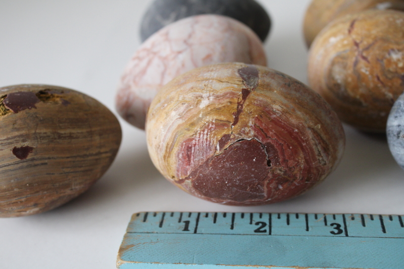 photo of lot of large carved stone eggs, weathered natural stone marble grey, granite, golden brown jasper #2