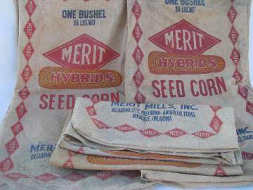 catalog photo of lot of old Merit advertising seed corn bags, vintage cotton sacks