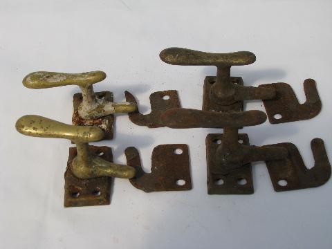 photo of lot of old antique architectural casement window or shutter latches, brass and iron #1