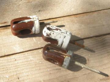 catalog photo of lot of old brown ceramic architectural screw base standoff insulators