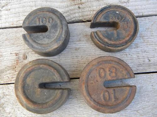 photo of lot of old iron scale weights for farm or feed mill platform or beam scale #3