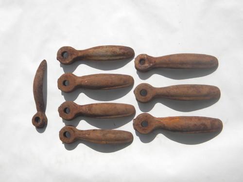 photo of lot of primitive old cast iron farm equipment handles #1