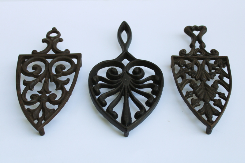 photo of lot of three old cast iron trivets for sadirons or pots & pans, vintage kitchen wall art  #1