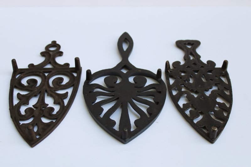 photo of lot of three old cast iron trivets for sadirons or pots & pans, vintage kitchen wall art #5