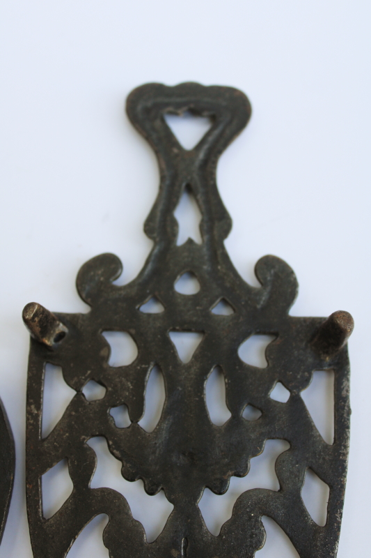 photo of lot of three old cast iron trivets for sadirons or pots & pans, vintage kitchen wall art #6