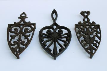 catalog photo of lot of three old cast iron trivets for sadirons or pots & pans, vintage kitchen wall art 