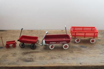 catalog photo of lot of tiny miniature toy wagons for ornaments or dollhouses, Radio Flyer, metal little red wagon etc 