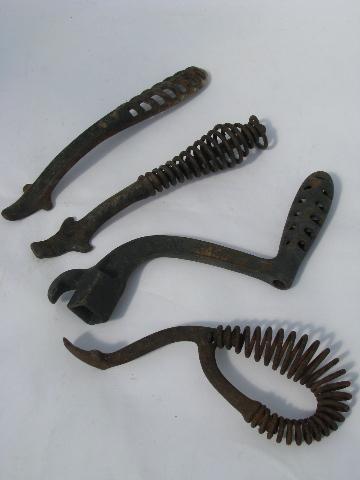 photo of lot old antique iron stove burner lifter handles, vintage kitchen #1