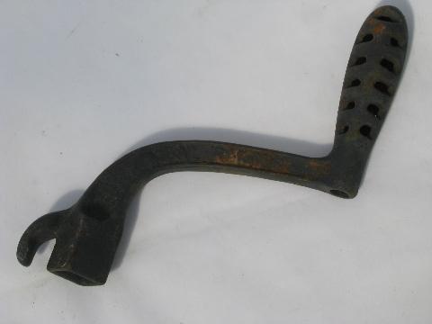 photo of lot old antique iron stove burner lifter handles, vintage kitchen #4