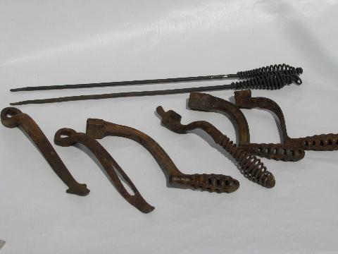 photo of lot old antique iron stove burner lifter handles, vintage kitchen #1