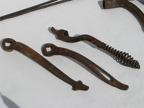 photo of lot old antique iron stove burner lifter handles, vintage kitchen #2