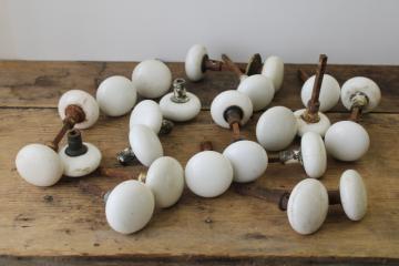 catalog photo of lot old antique white porcelain door knobs for repurpose or upcycle, crazed stained shabby 