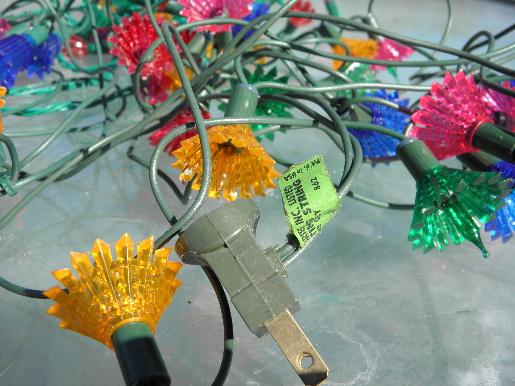 photo of lot old midget Christmas tree lights, fancy plastic flower reflectors #2