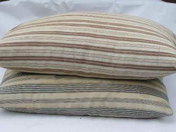 catalog photo of lot primitive old feather pillows, vintage brown and blue stripe ticking