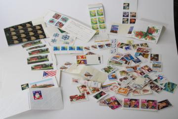 photo of lot unused USPS postage stamps & postcards, Christmas design stamps, flowers, Elvis etc