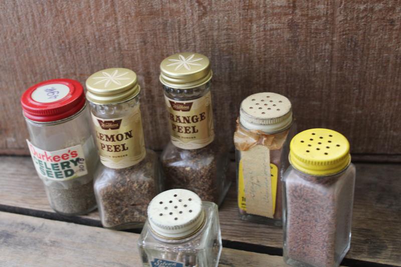 photo of lot vintage glass spice jars, some metal shaker lids, old advertising labels #2