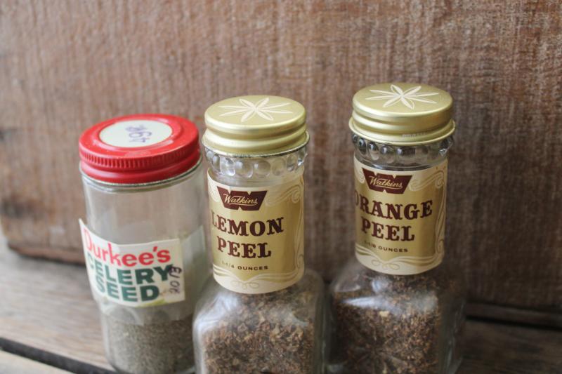 photo of lot vintage glass spice jars, some metal shaker lids, old advertising labels #5
