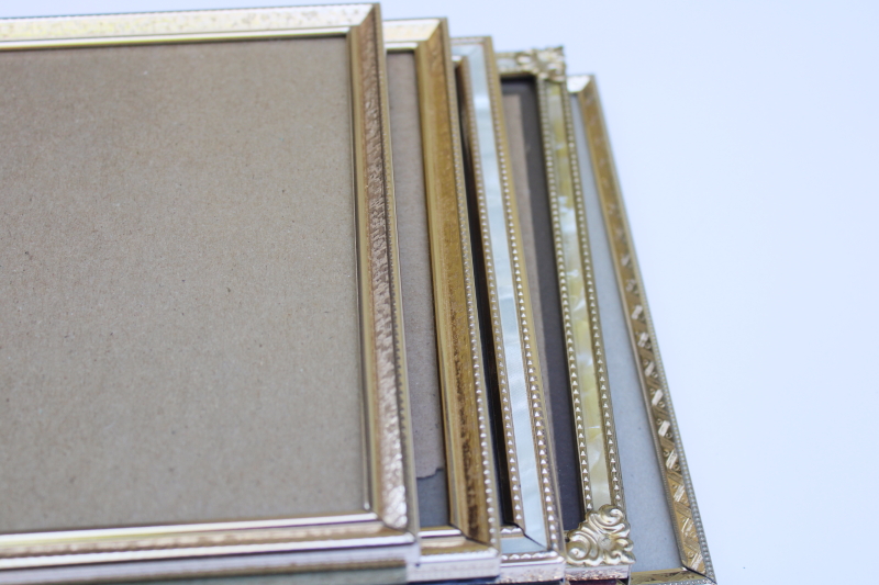 photo of lot vintage gold tone metal picture photo frames 5 x 7 including two hinged double frames #7