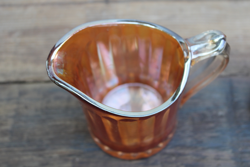 photo of marigold orange vintage carnival glass pitcher, large creamer amber iridescent color glass  #3