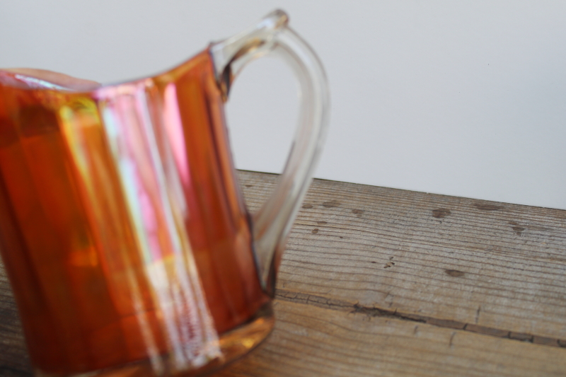 photo of marigold orange vintage carnival glass pitcher, large creamer amber iridescent color glass  #6
