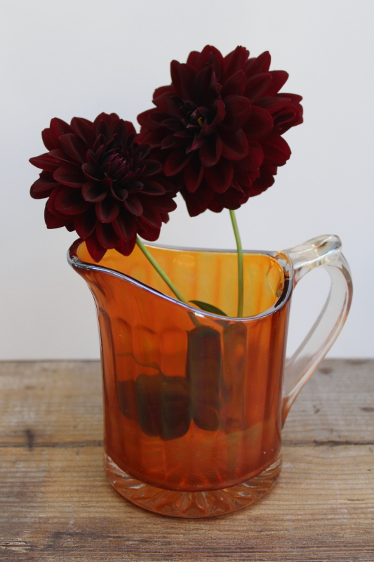 photo of marigold orange vintage carnival glass pitcher, large creamer amber iridescent color glass  #7