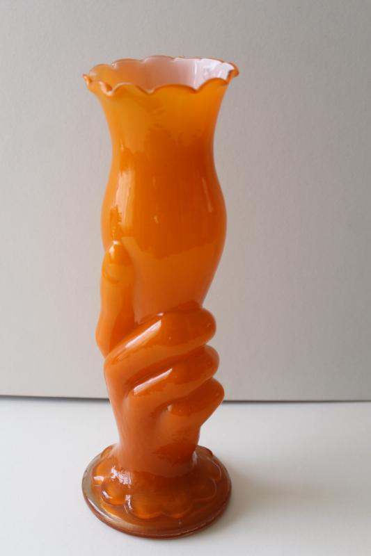 photo of mid century mod vintage hand holding trumpet vase, cased glass in orange #6