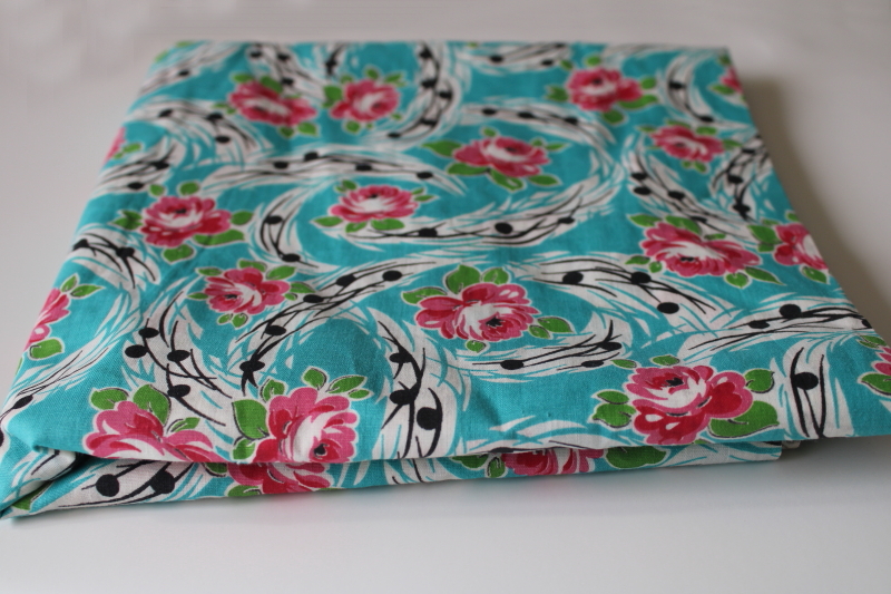 photo of mid-century vintage cotton fabric, retro floral magenta pink roses on turquoise w/ black #3