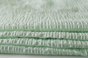 photo of mid-century vintage fabric, soft green sheer nylon plisse crinkle pucker texture