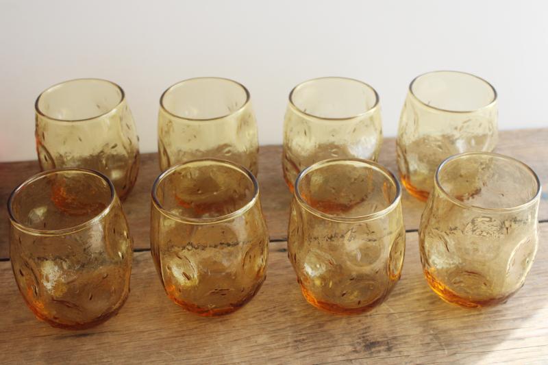 photo of mid-century mod vintage textured amber glass roly poly glasses, pinch shape thumbprint tumblers #1