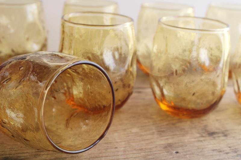 photo of mid-century mod vintage textured amber glass roly poly glasses, pinch shape thumbprint tumblers #3