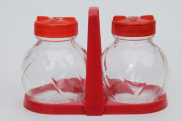 catalog photo of mid-century vintage red plastic rack & glass shakers, retro kitchen S&P set